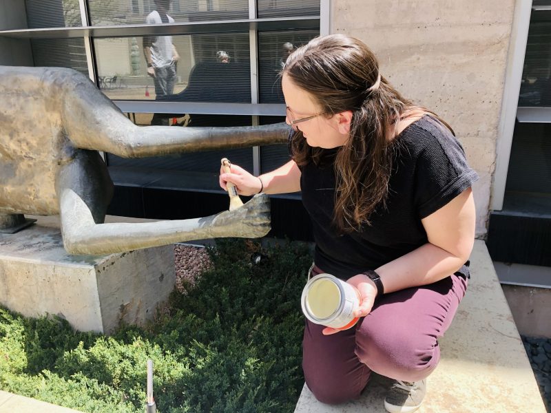 Museum staff sculpture restoration