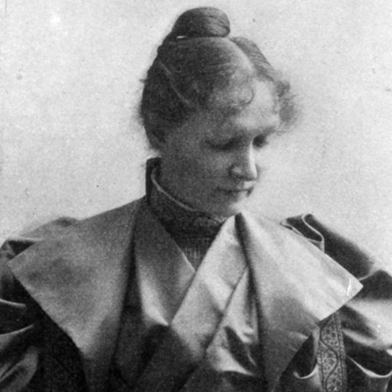 Black and white portrait of Mary Hallock looking downward