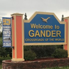 A sign that reads "Welcome to Gander Crossroads of the World"