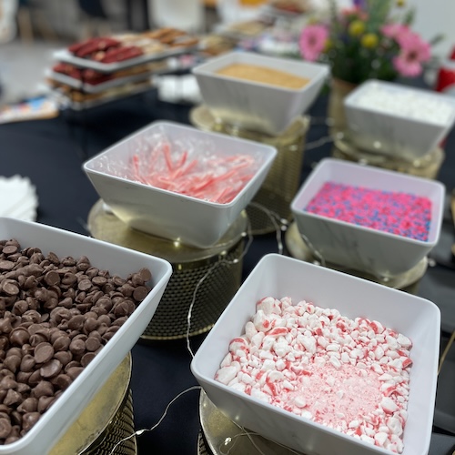 Close up image of sweet toppings on a buffet table
